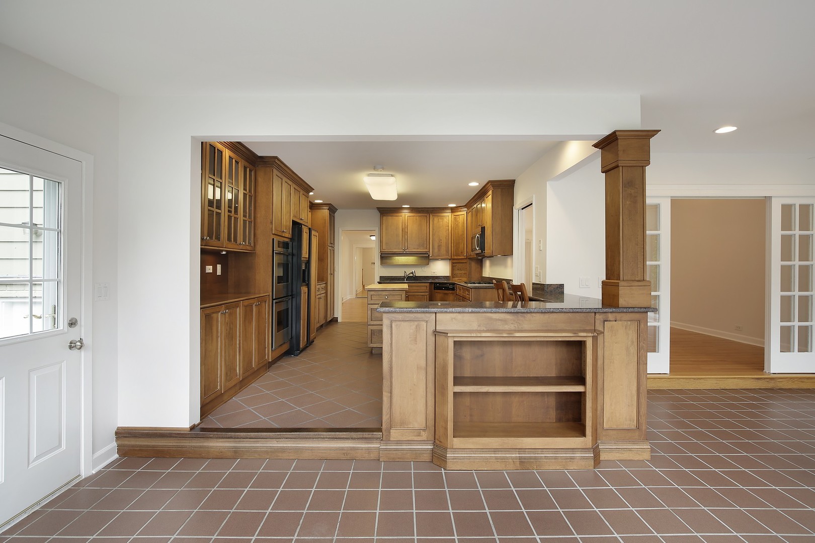 616 Dundee Road Glencoe, IL 60022 - Photo 8 of 22 a view of kitchen with refrigerator cabinets and outdoor view
