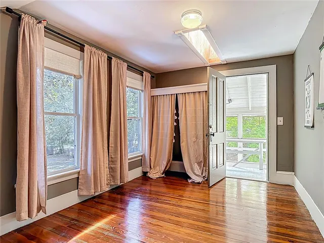 a backyard of a house with a yard and outdoor seating