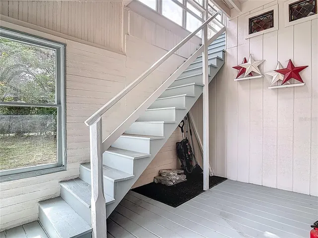 an aerial view of residential houses with yard