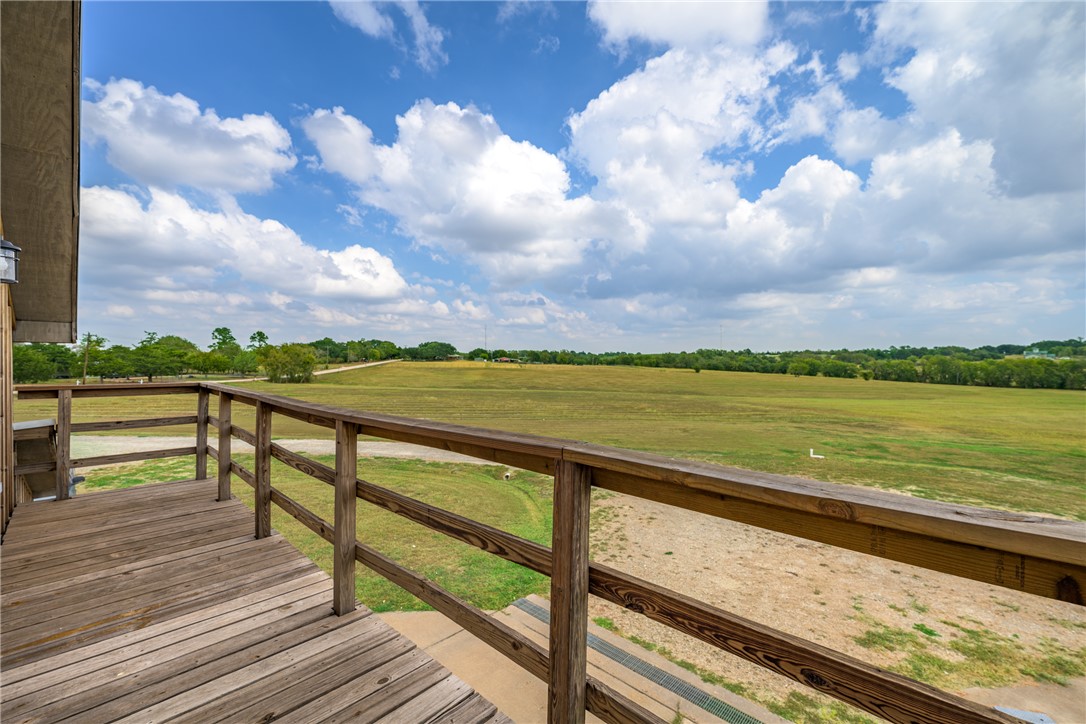 1441 Salem Road Brenham, TX 77833 - Photo 2 of 34 Wooden terrace with a view of countryside and a yard