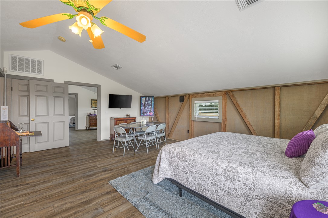 1441 Salem Road Brenham, TX 77833 - Photo 21 of 34 Bedroom with lofted ceiling, wood finished floors, and ceiling fan