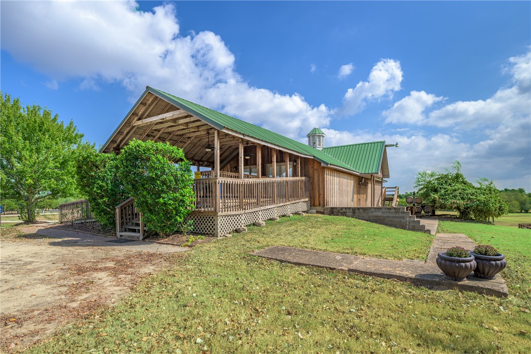 1441 Salem Road Brenham, TX 77833 - Photo 4 of 34 View of green lawn with a wooden deck