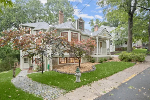 a front view of a house with garden