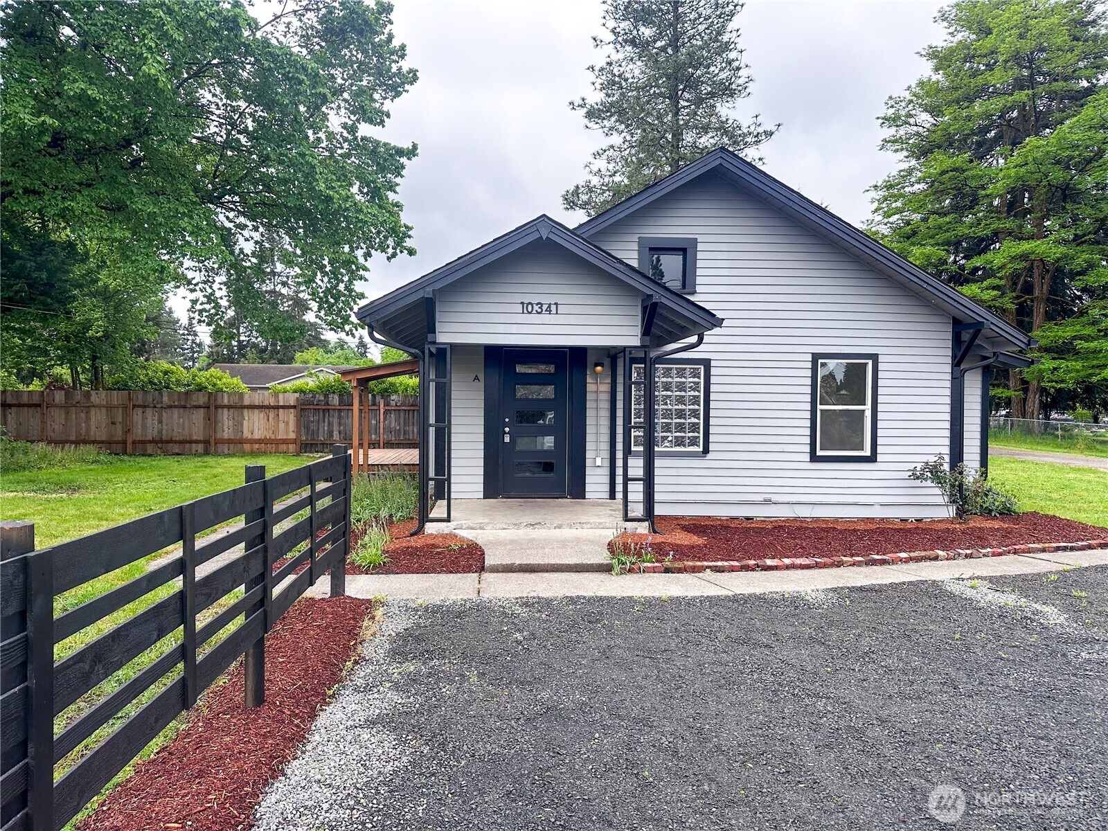 10341 184th Avenue Southwest Rochester, WA 98579 - Photo 1 of 36 a front view of a house with a yard