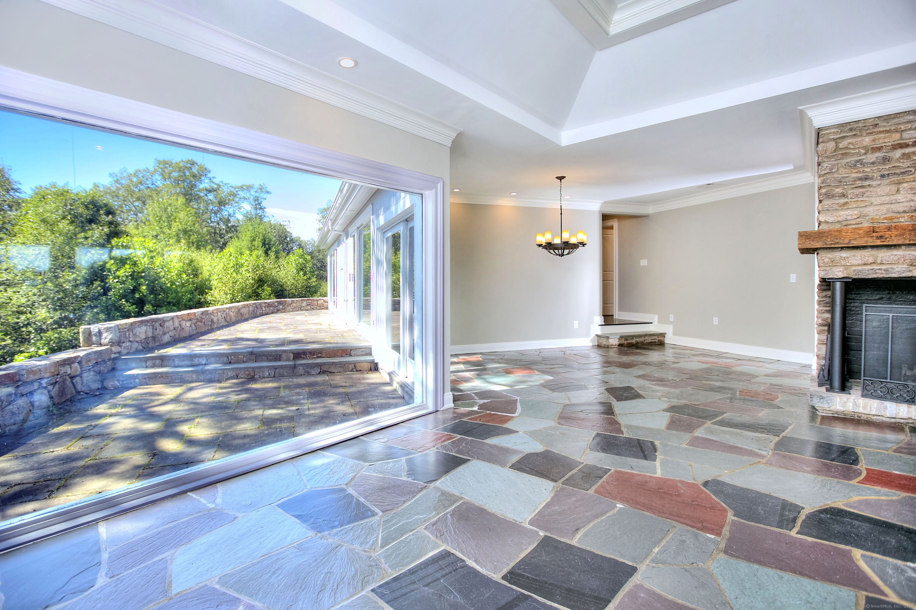 27 Rogues Ridge Road Weston, CT 06883 - Photo 12 of 39 a view of a living room and a floor to ceiling window