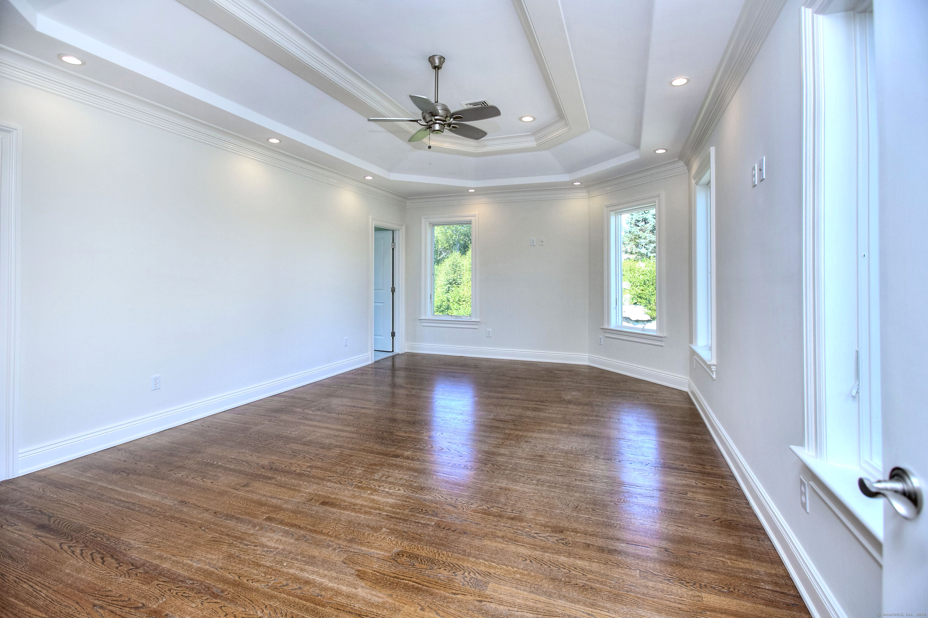 27 Rogues Ridge Road Weston, CT 06883 - Photo 17 of 39 wooden floor in an empty room with a window