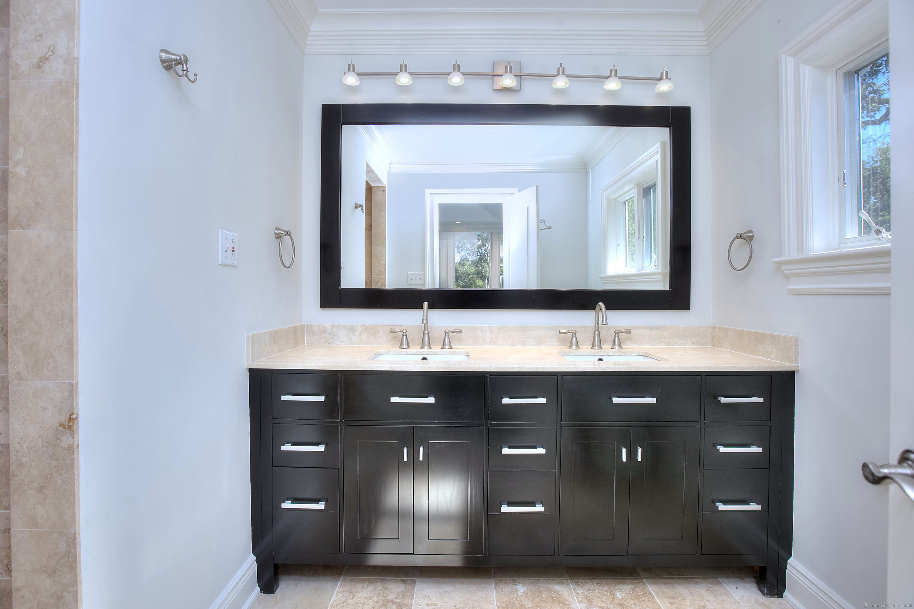 27 Rogues Ridge Road Weston, CT 06883 - Photo 22 of 39 a bathroom with a double vanity sink and mirror