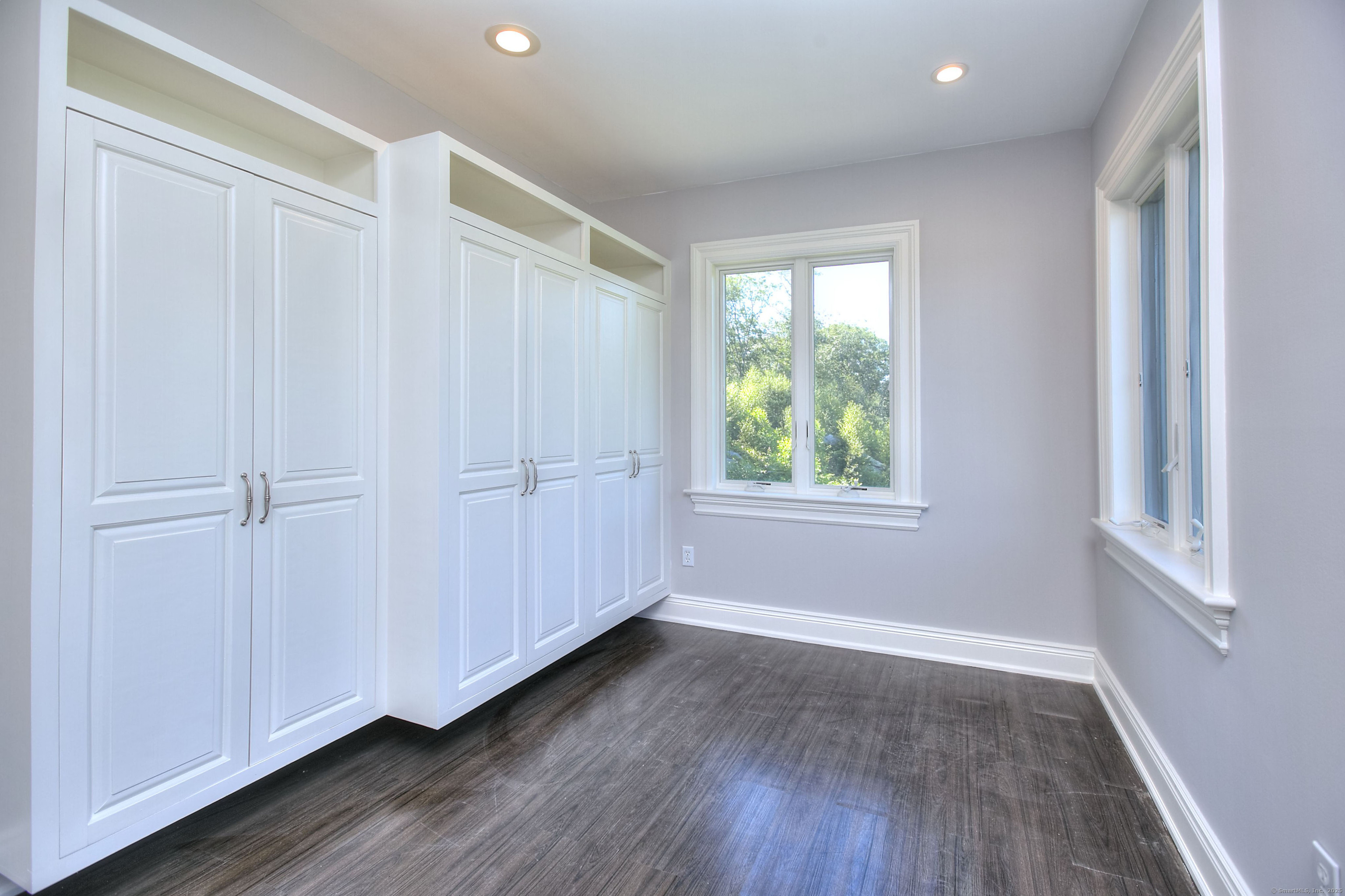 27 Rogues Ridge Road Weston, CT 06883 - Photo 25 of 39 a view of a livingroom with wooden floor and window