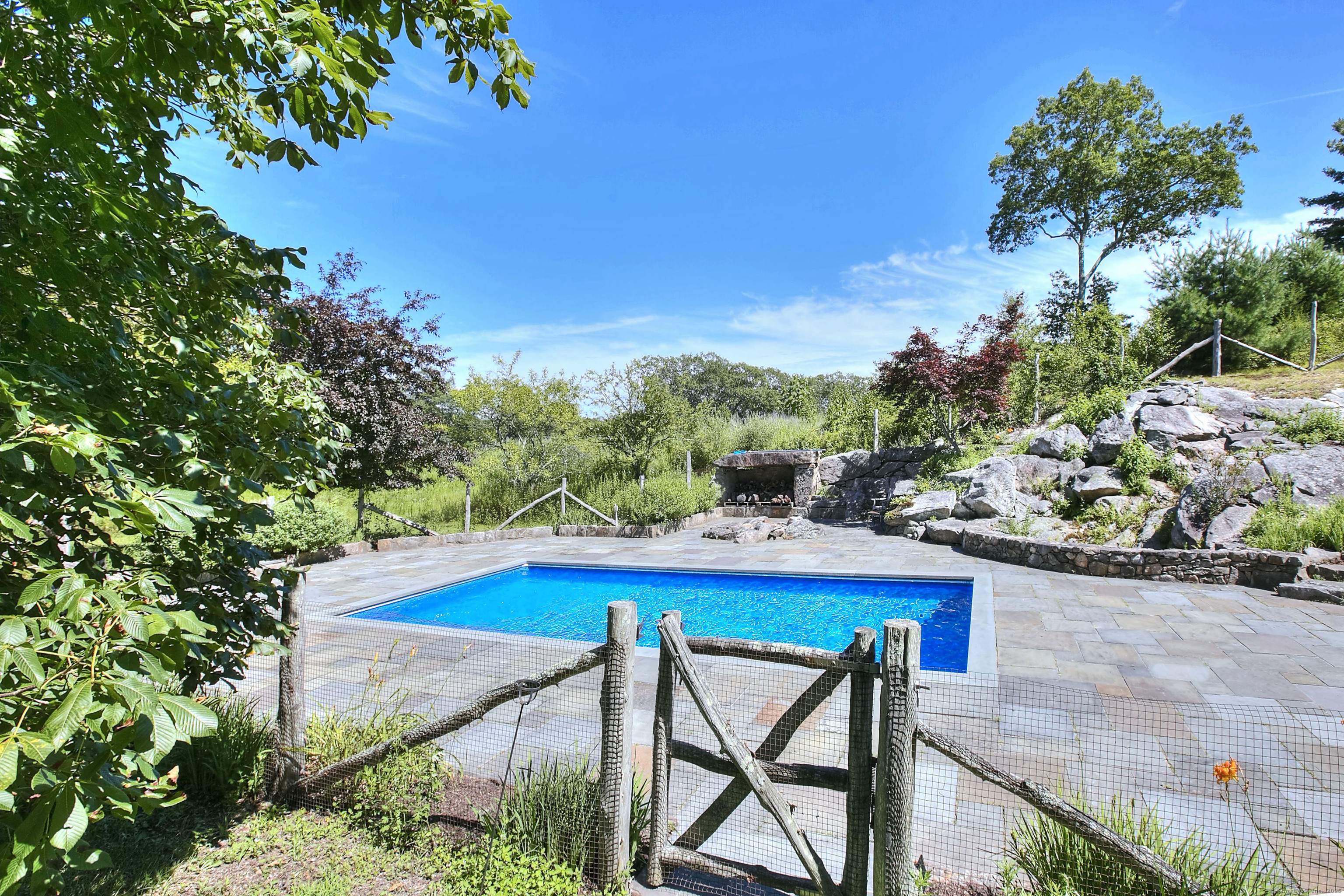 27 Rogues Ridge Road Weston, CT 06883 - Photo 31 of 39 a view of balcony with furniture and a garden