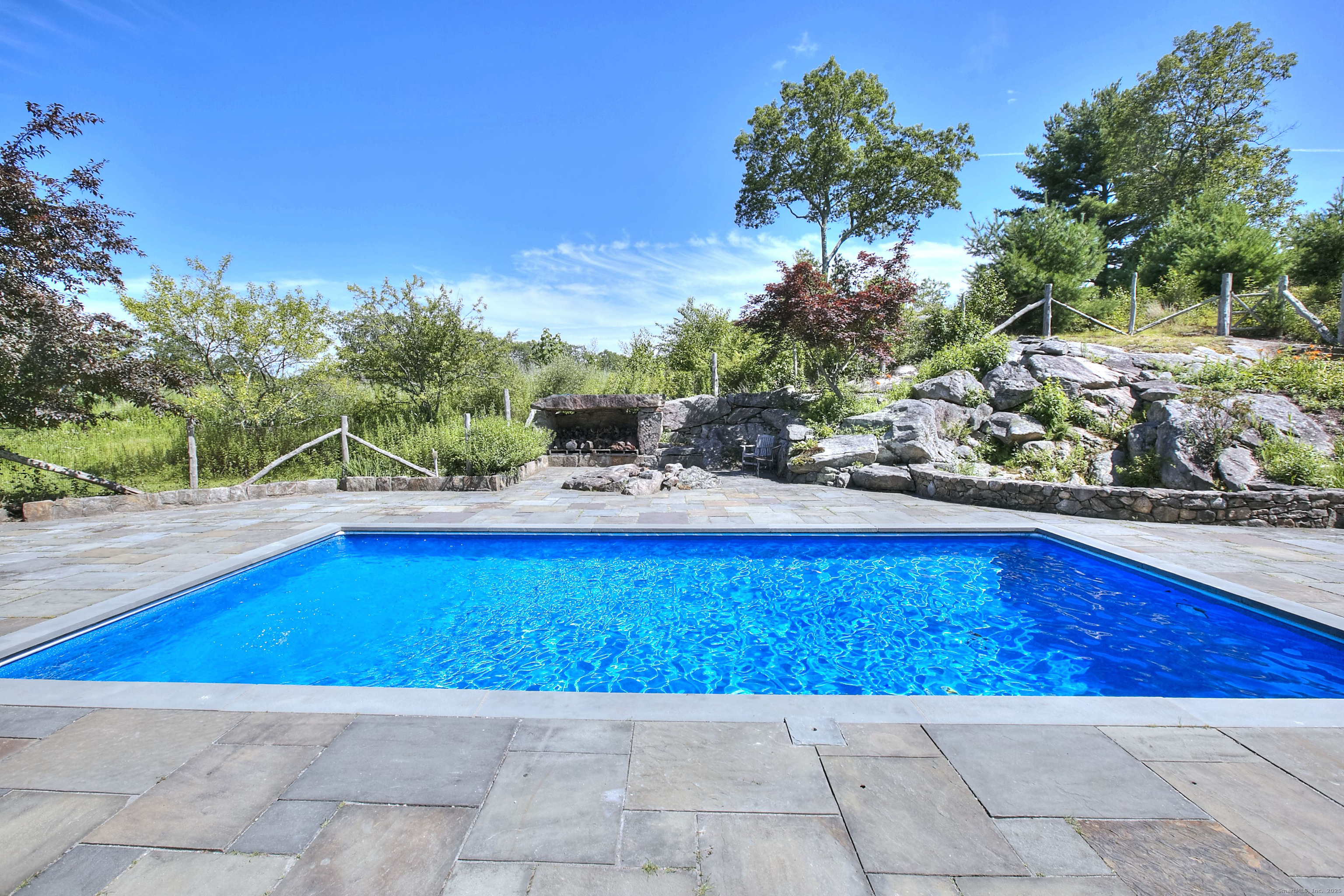 27 Rogues Ridge Road Weston, CT 06883 - Photo 32 of 39 a view of a backyard