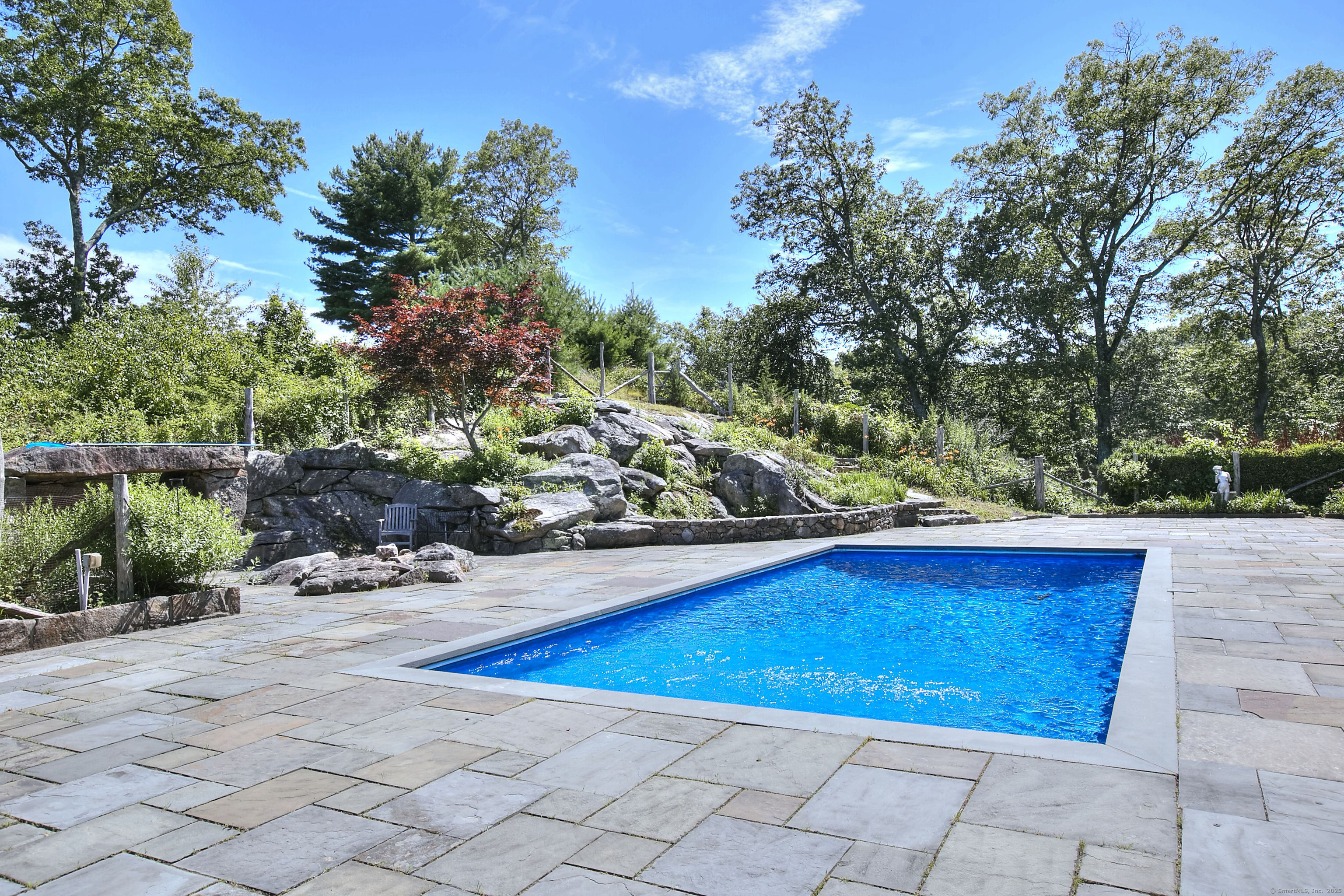27 Rogues Ridge Road Weston, CT 06883 - Photo 34 of 39 a view of a outdoor space and swimming pool