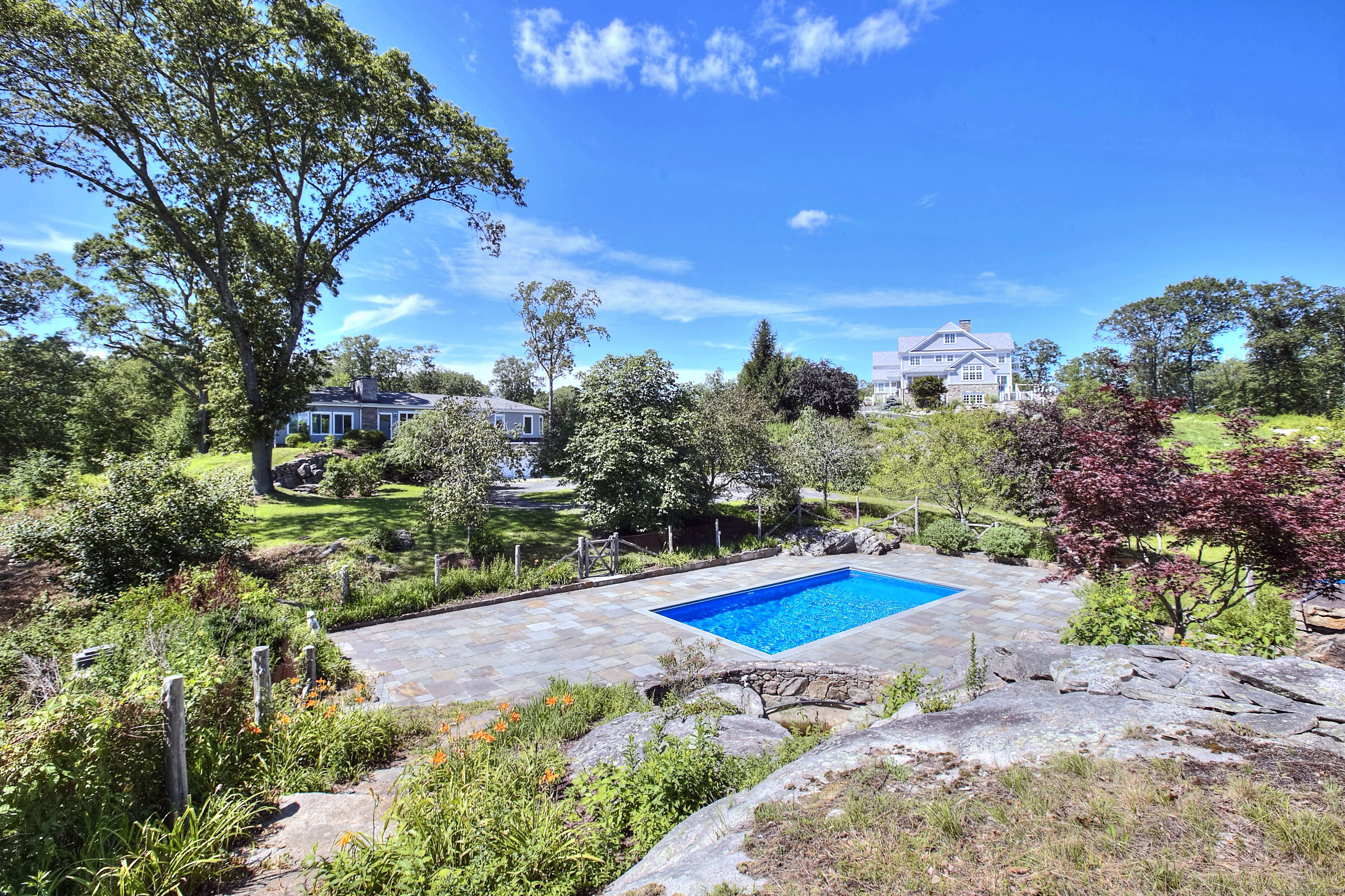 27 Rogues Ridge Road Weston, CT 06883 - Photo 37 of 39 a view of swimming pool with lawn chairs and potted plants