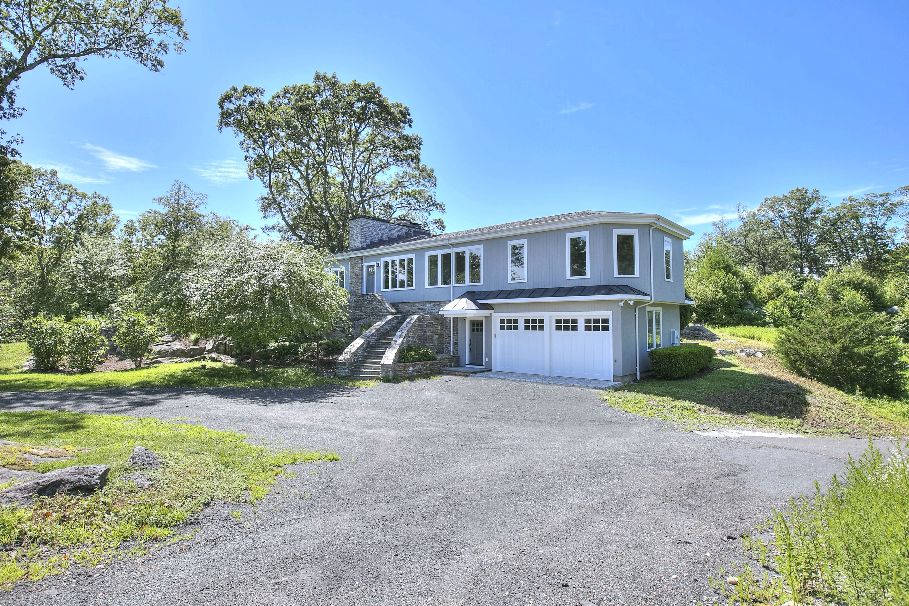 27 Rogues Ridge Road Weston, CT 06883 - Photo 39 of 39 a view of a house with a yard and large trees