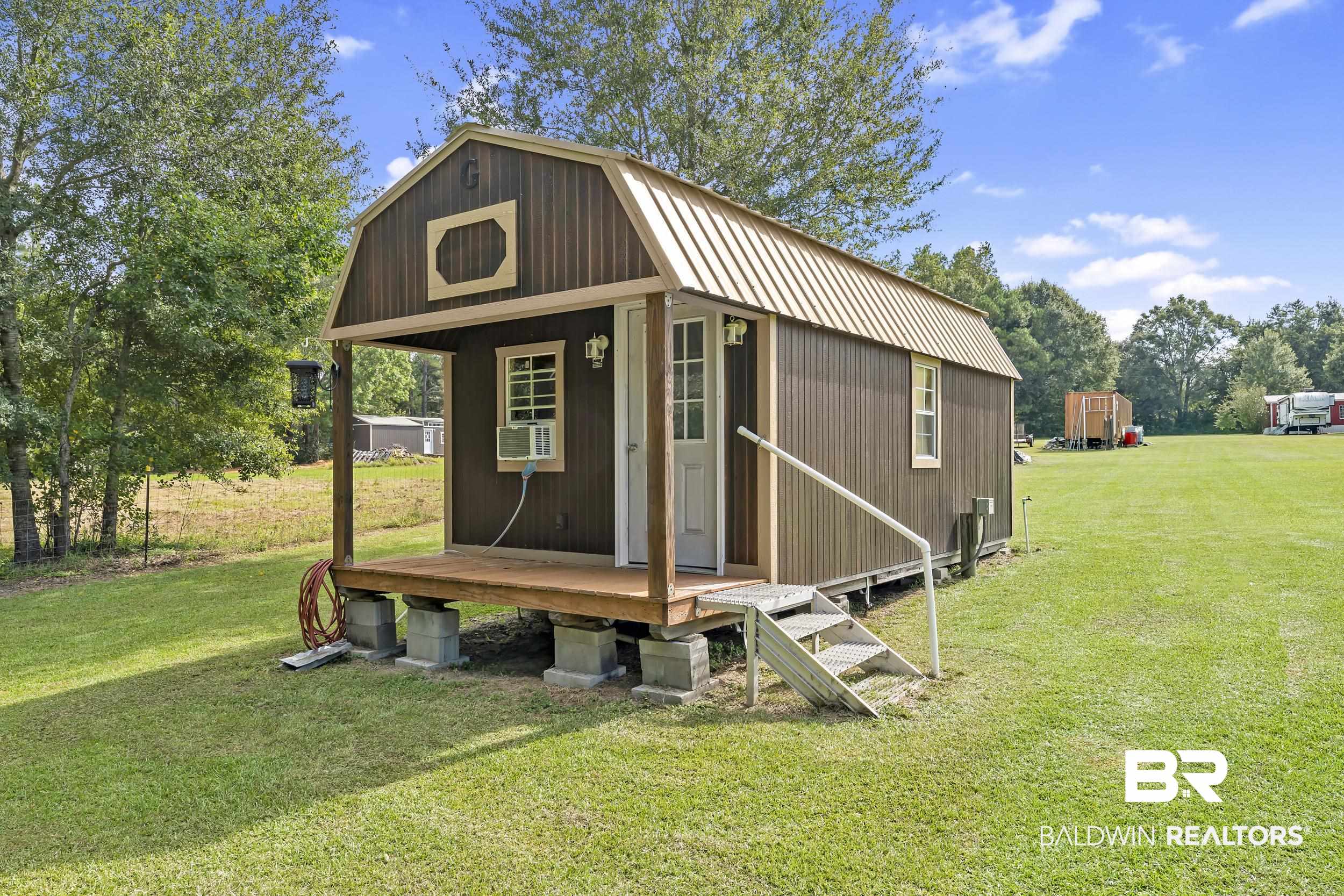 22823 Lanier Road Robertsdale, AL 36567 - Photo 28 of 46 View of outbuilding featuring cooling unit