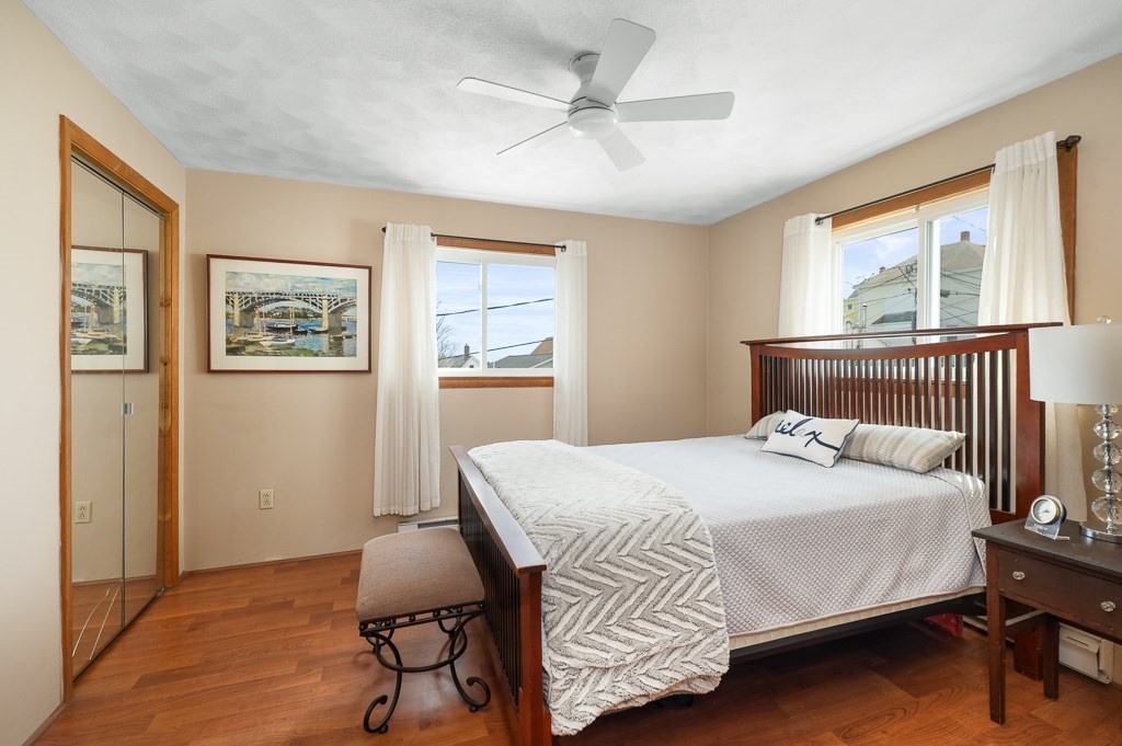 9 Alpine Court Gloucester, MA 01930 - Photo 24 of 32 a bedroom with a bed and a painting on the wall