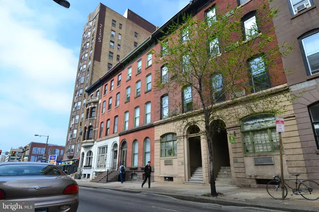 a city street lined with tall buildings