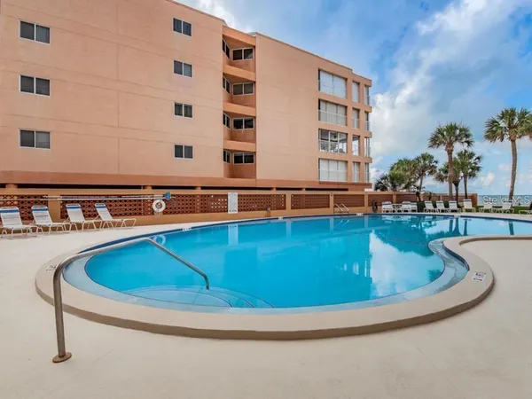 a view of swimming pool with outdoor seating
