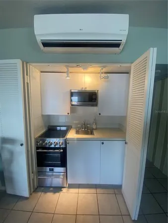 a kitchen with stainless steel appliances a stove and a refrigerator