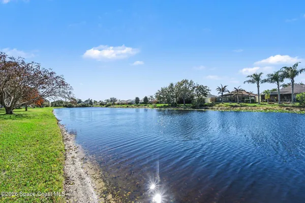 a view of a lake with houses in the back