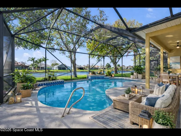 a view of a swimming pool with a patio