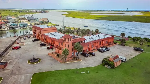 an aerial view of a house with outdoor space