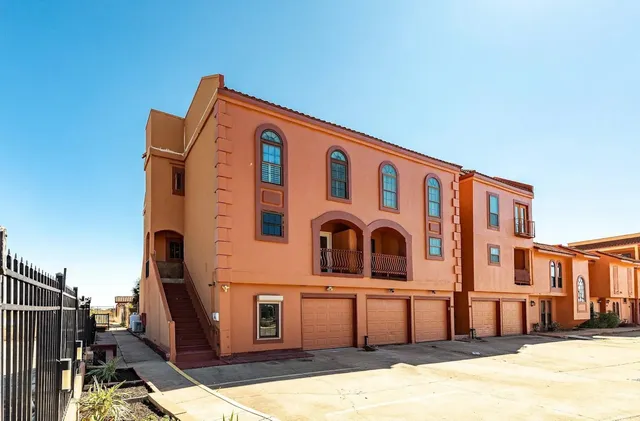 a front view of a building with many windows