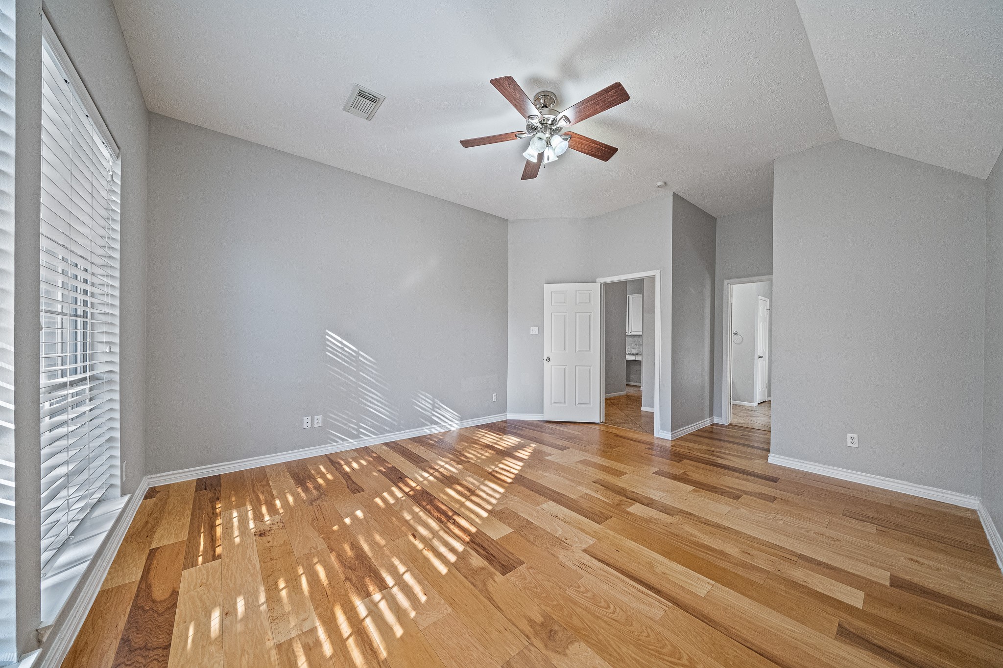 23223 Hazel Field Court Katy, TX 77494 - Photo 21 of 27 a view of empty room with wooden floor and fan