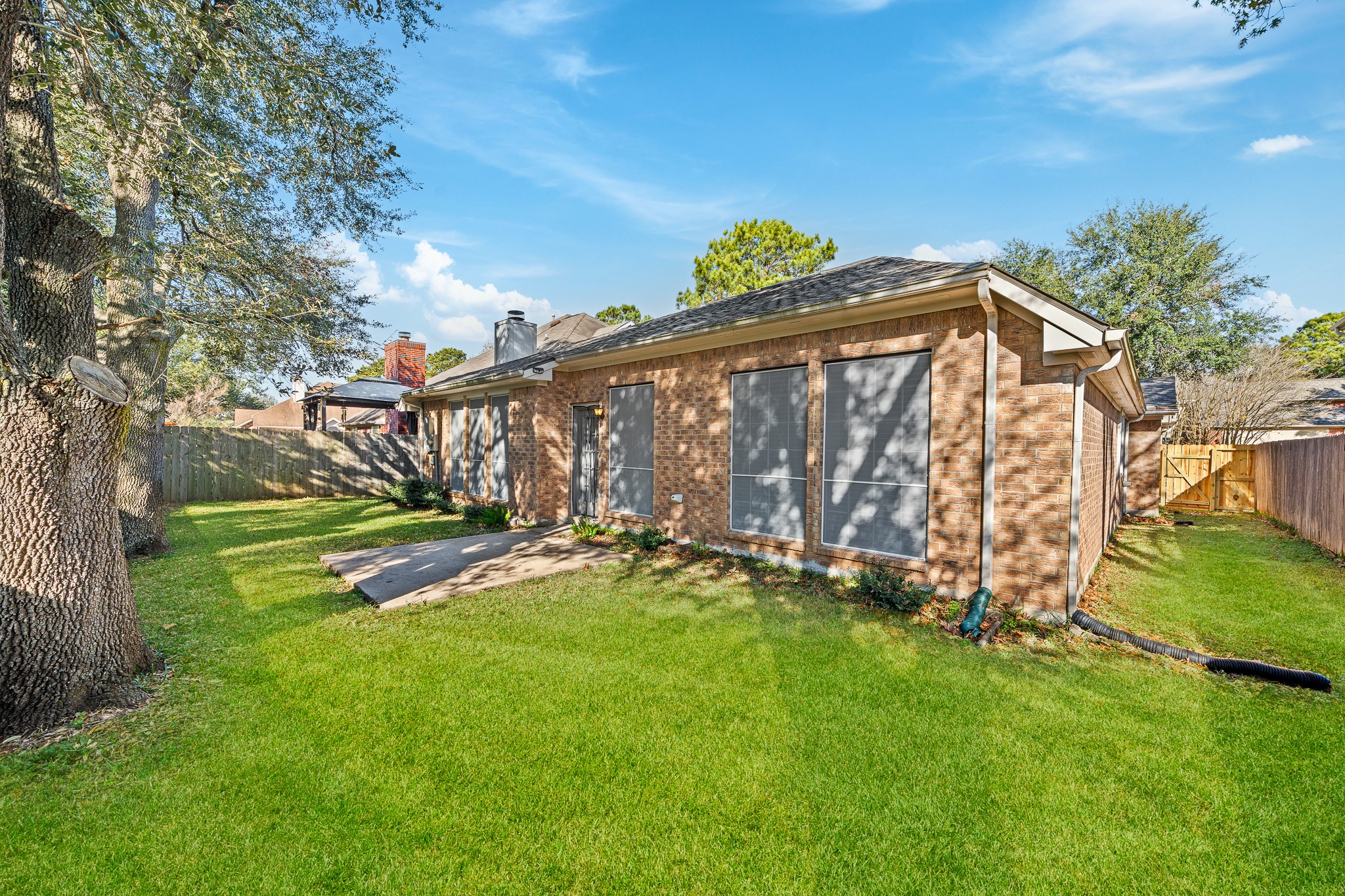 23223 Hazel Field Court Katy, TX 77494 - Photo 25 of 27 a view of an house with backyard and a tree