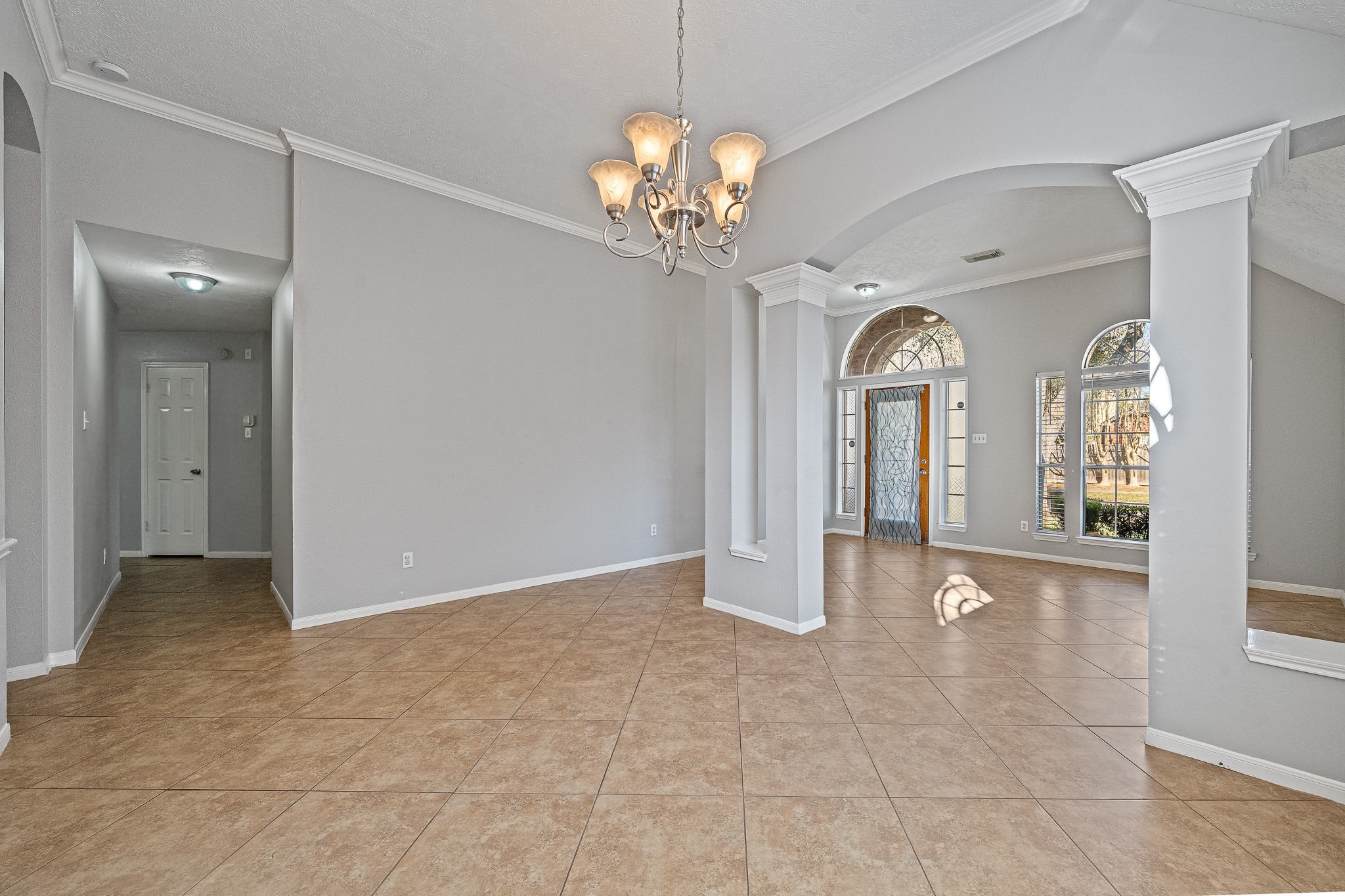 23223 Hazel Field Court Katy, TX 77494 - Photo 5 of 27 a view of an empty room with a chandelier