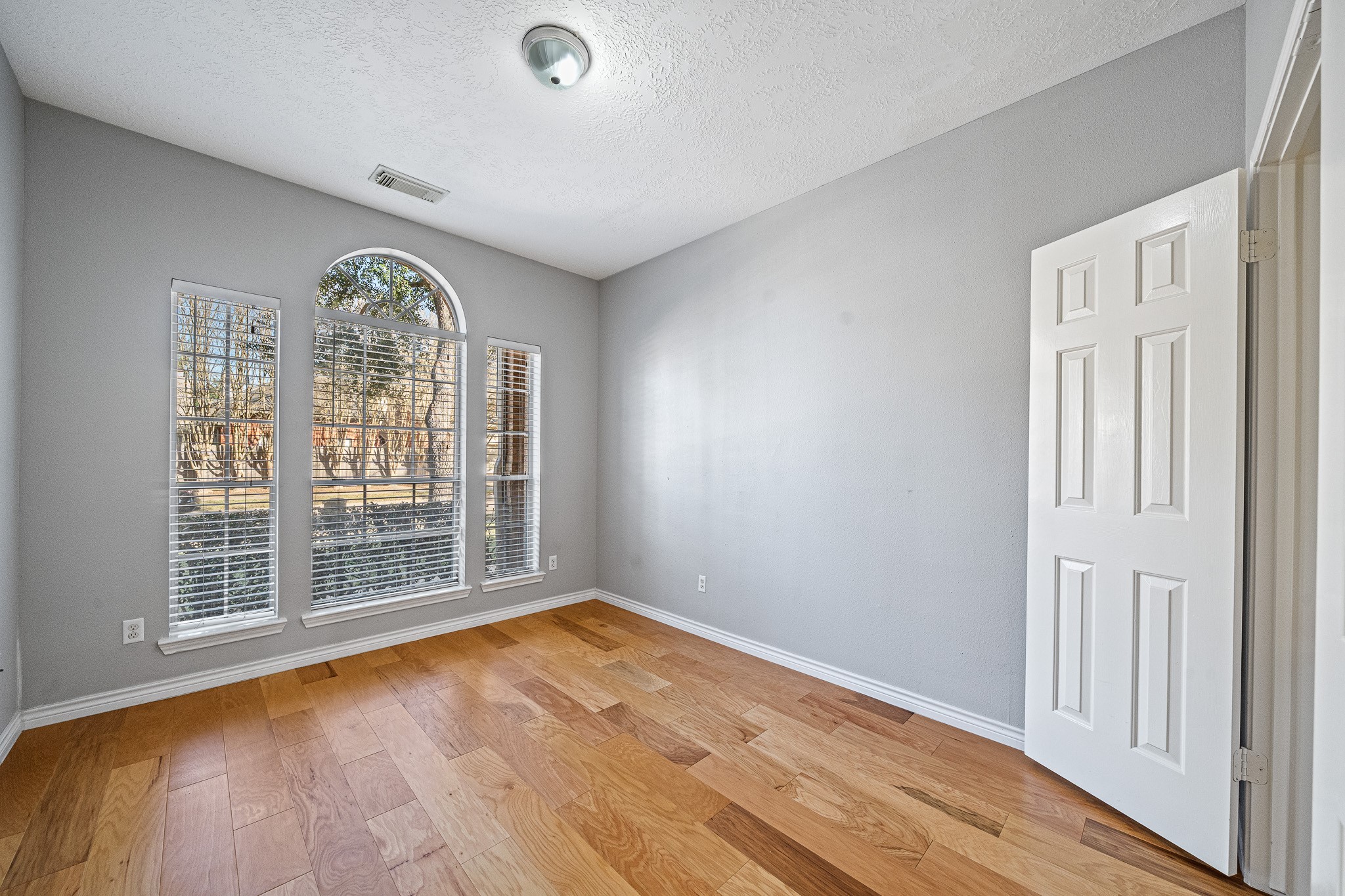 23223 Hazel Field Court Katy, TX 77494 - Photo 6 of 27 a view of empty room with wooden floor and fan
