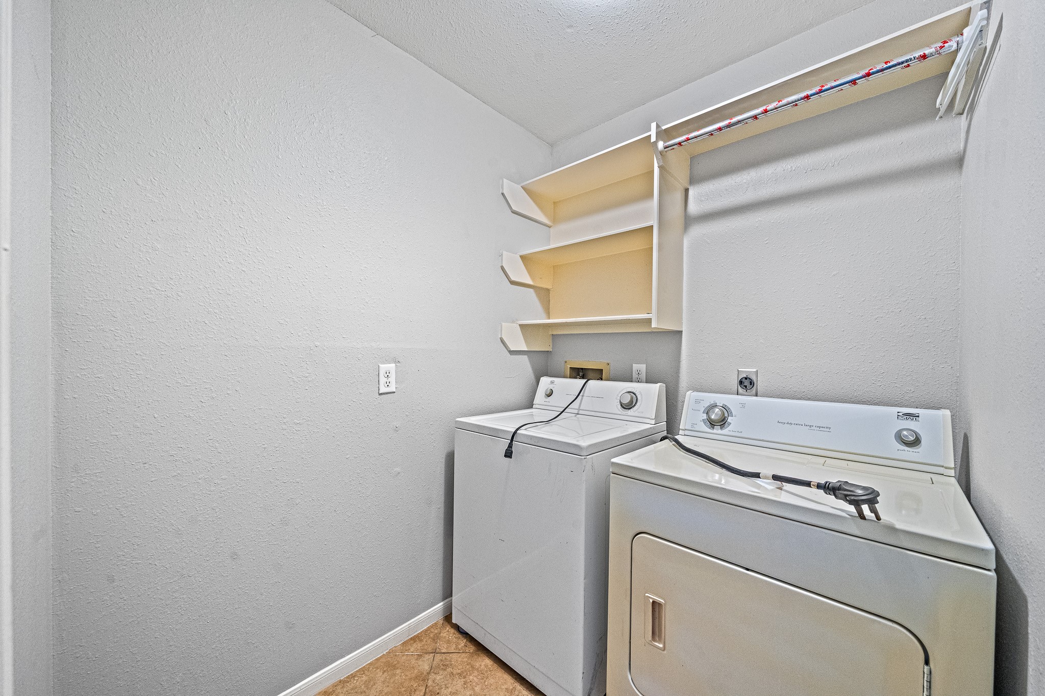23223 Hazel Field Court Katy, TX 77494 - Photo 8 of 27 a utility room with dryer and washer