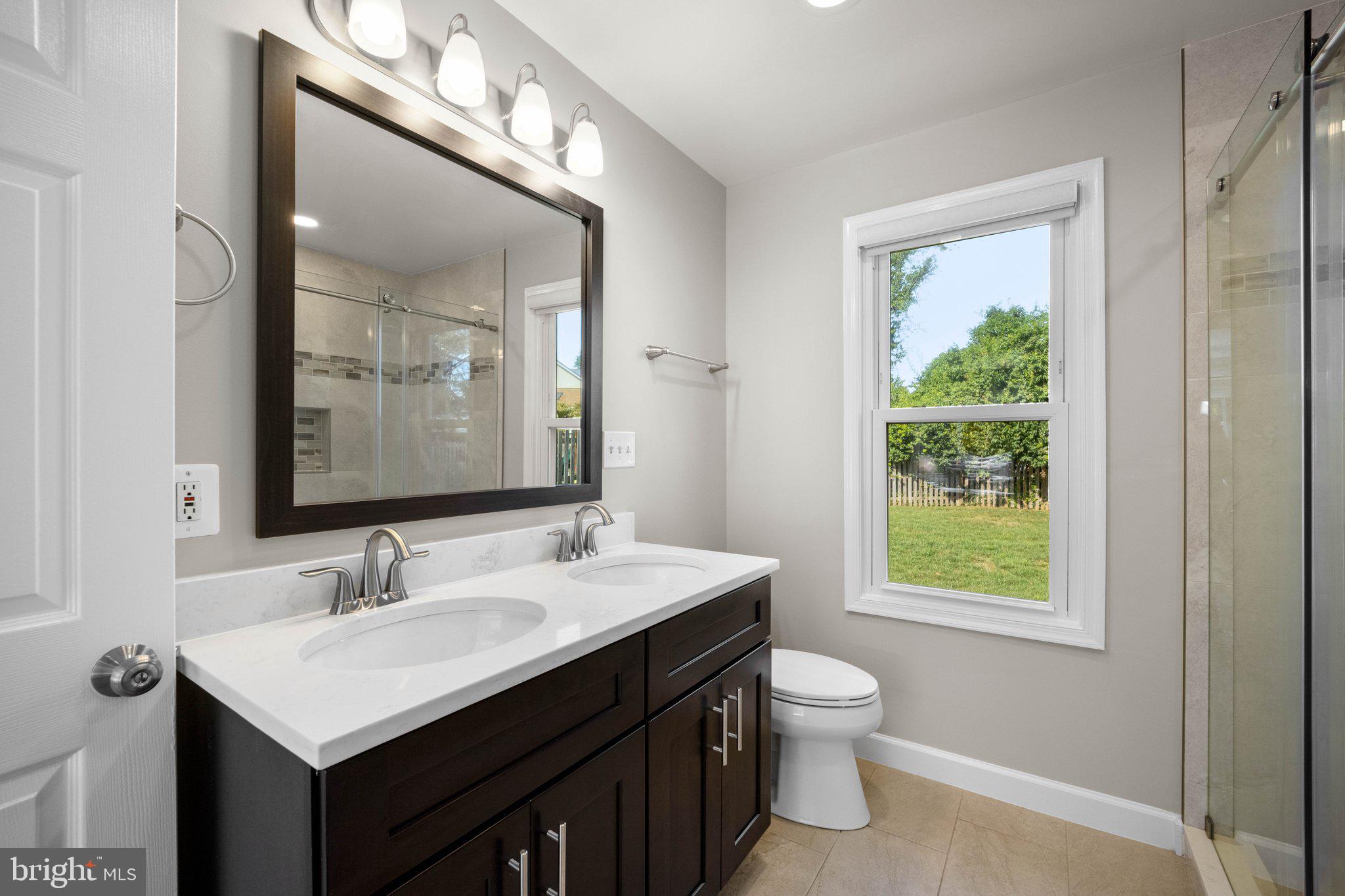 8412 Farrell Drive Chevy Chase, MD 20815 - Photo 23 of 45 En Suite Renovated Bath with double sink vanity