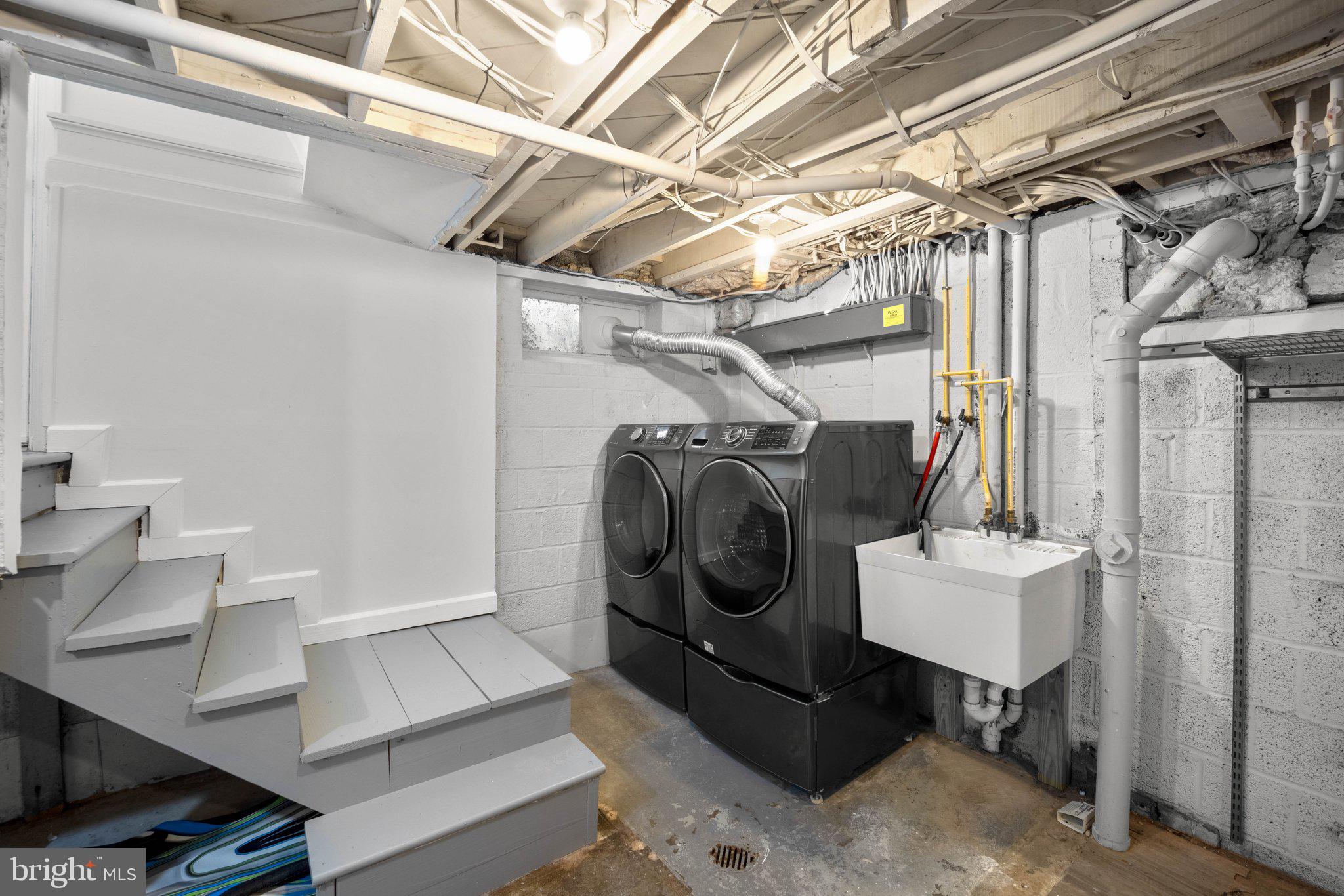 8412 Farrell Drive Chevy Chase, MD 20815 - Photo 38 of 45 Lower Level Laundry Room with front load w/d