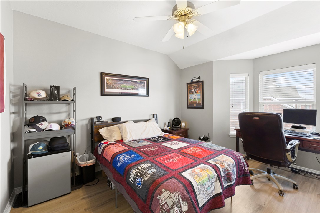 1198 Jones-Butler Road, Unit 3114 College Station, TX 77840 - Photo 10 of 13 a bedroom with a bed and a chair