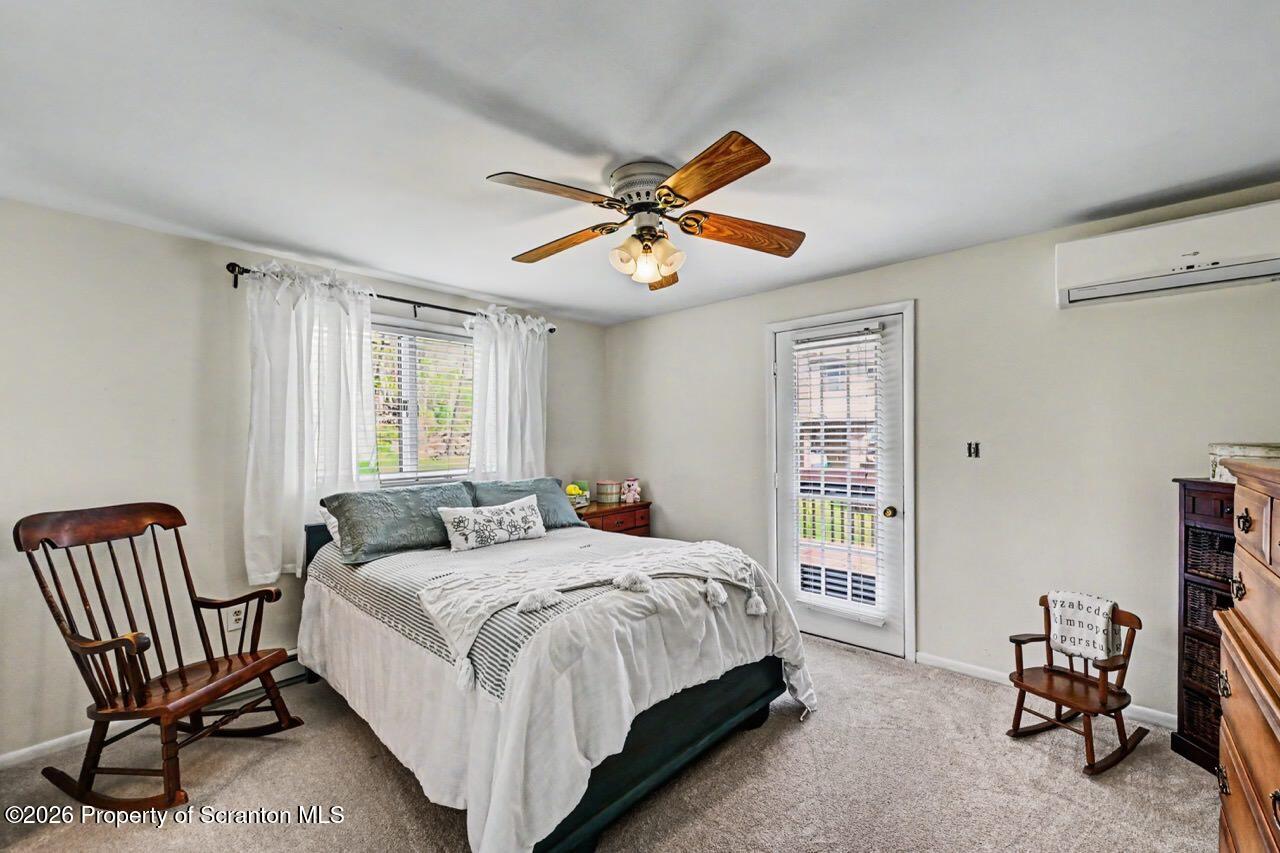 719 Scott Road Clarks Summit, PA 18411 - Photo 25 of 51 a bedroom with a bed chair and a window