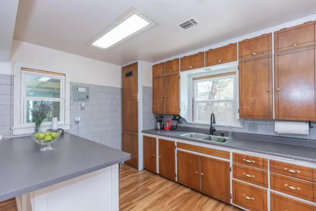 a bathroom with a sink double vanity and a mirror