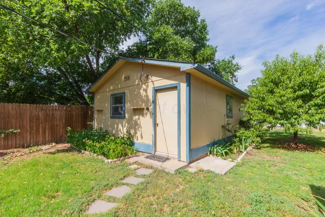 a front view of house with green space