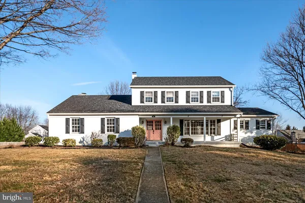a front view of a house with yard