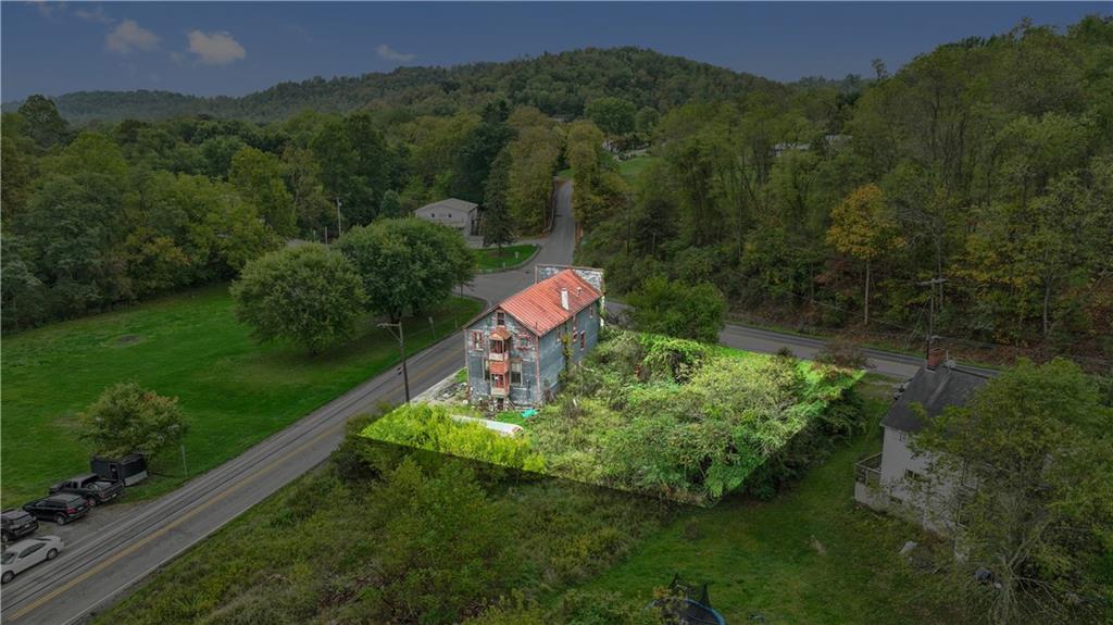 605 Lone Pine Road Washington, PA 15301 - Photo 11 of 39 a backyard of a house with lots of green space and mountain view
