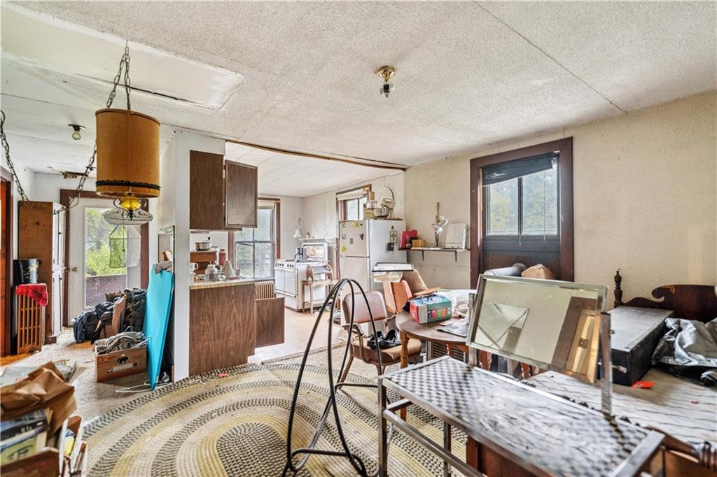 605 Lone Pine Road Washington, PA 15301 - Photo 17 of 39 a view of a livingroom with furniture and a ceiling fan