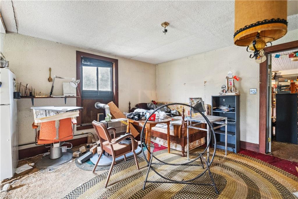 605 Lone Pine Road Washington, PA 15301 - Photo 18 of 39 a living room with furniture a flat screen tv and a table