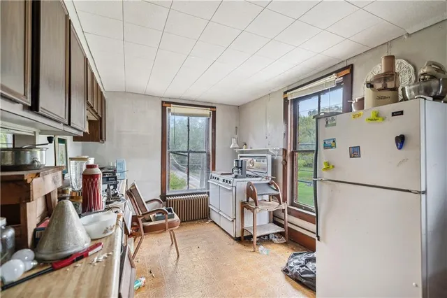 a kitchen with stainless steel appliances granite countertop sink stove and cabinets