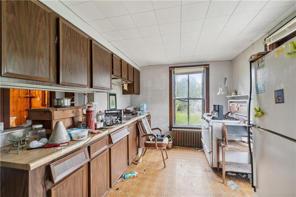 605 Lone Pine Road Washington, PA 15301 - Photo 20 of 39 a kitchen with stainless steel appliances granite countertop sink stove and cabinets