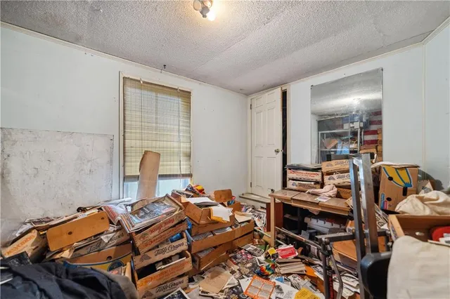 a bedroom with a bed and walk in closet