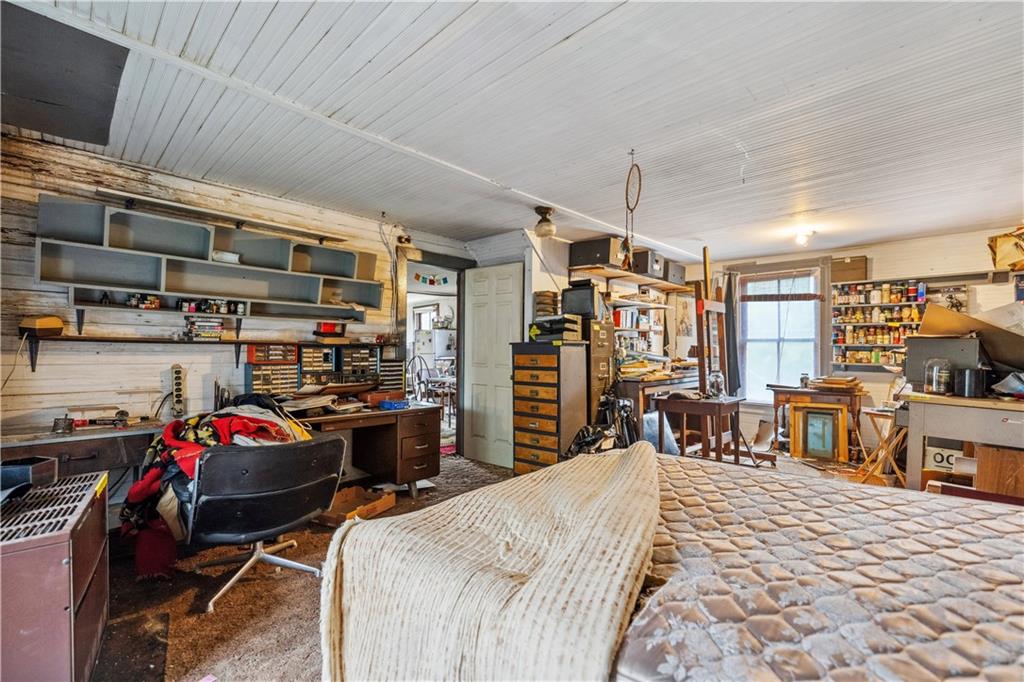 605 Lone Pine Road Washington, PA 15301 - Photo 24 of 39 a bedroom with furniture a flat screen tv and a table