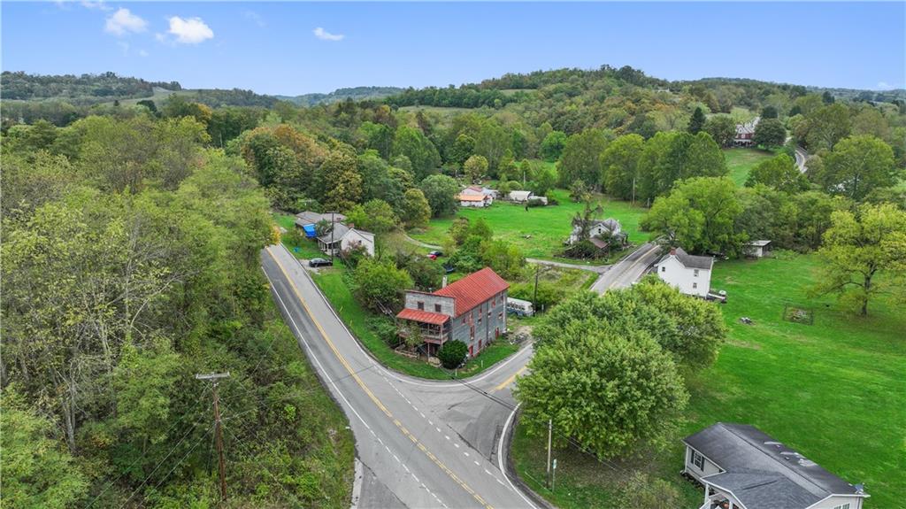 605 Lone Pine Road Washington, PA 15301 - Photo 34 of 39 a view of a house with a lush green forest