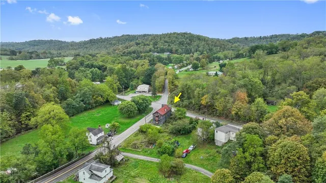 a view of a city with lush green forest