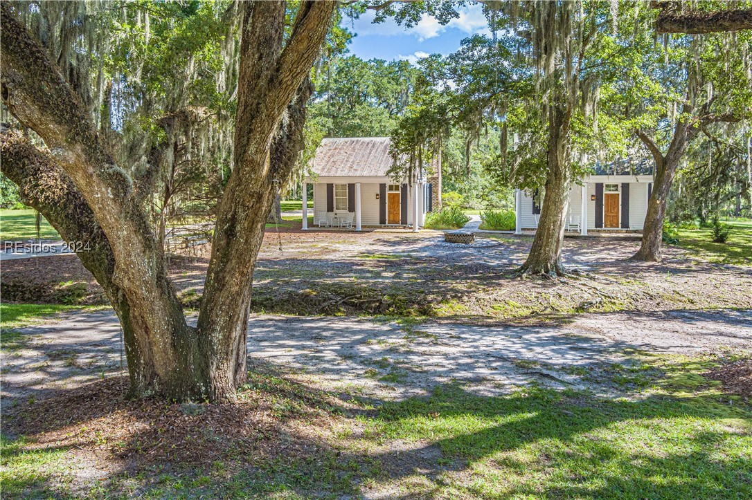 92 Dean Hall Road Seabrook, SC 29940 - Photo 16 of 99 Two identical, period designed guest houses ... elevations presented are viewed from the primary residence; front porches, custom exterior and interior features present in both guest houses