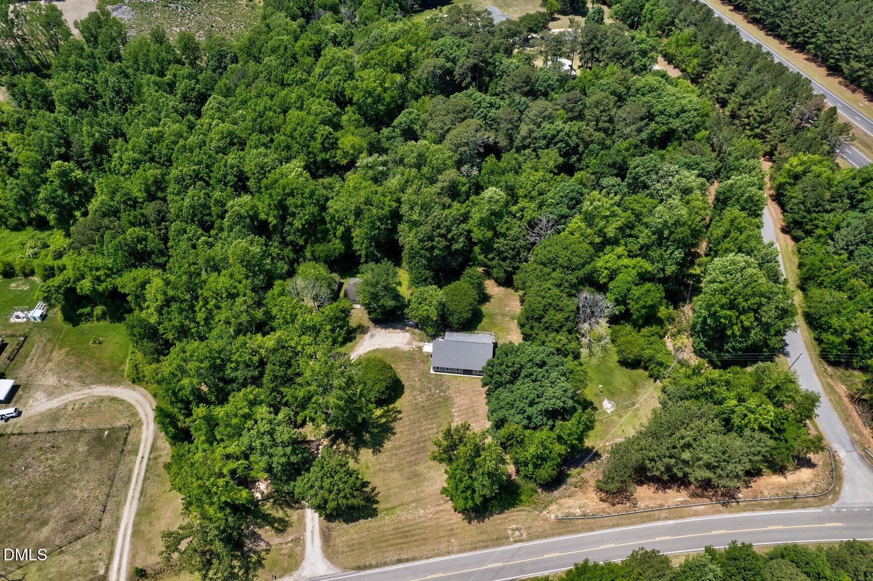 726 Thomas Road Rocky Mount, NC 27801 - Photo 52 of 55 an aerial view of a house with a yard