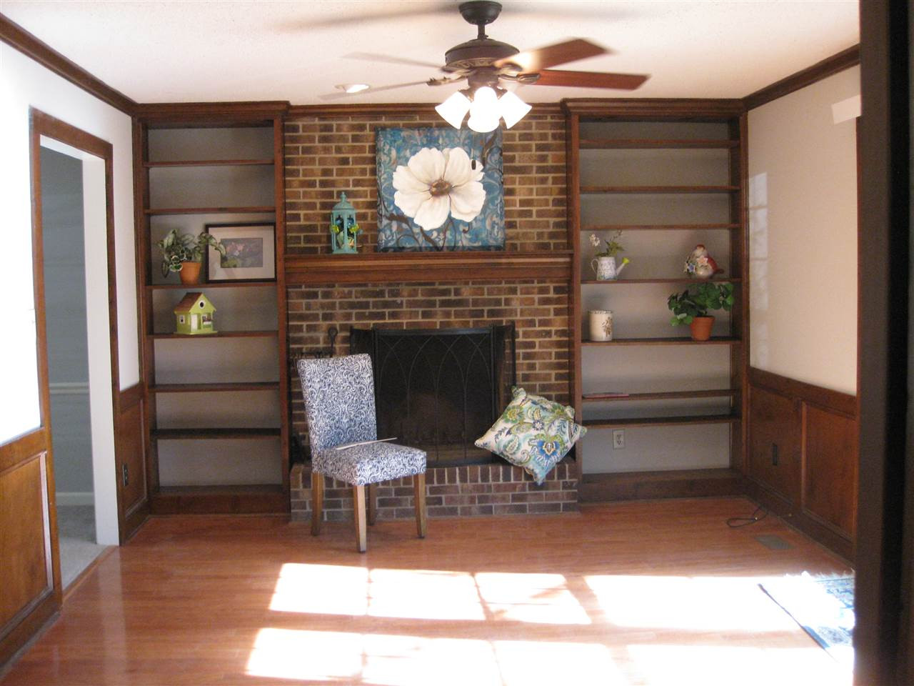 another spacious room with bookshelves. French doors to deck Family Room